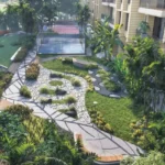 Hiranandani Maitri Park Chembur Aerial Glimpse Of Winding Stone Trail Lush Greenery And Recreation Court