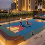 One Vara Goregaon Floodlit Basketball Court Photographed At Dusk With The Pool Visible In The Background