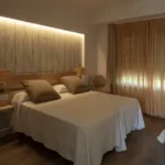 Raya Terraces JVPD Juhu Bedroom With Cream Bedding And Backlit Headboard