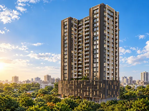Sahakar Acropolis Kala Nagar Bandra East High-Rise Tower Facade Surrounded By Lush Greenery Under A Bright Blue Sky