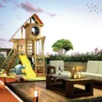 West 10 Juhu Gully Rooftop Children Play Zone With Wooden Slide Structure And Lounge Seating