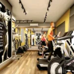 West 10 Juhu Gully Modern Fitness Centre With Cardio Equipment And Bodybuilding Murals