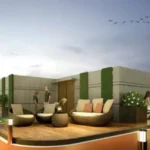 West 10 Juhu Gully Sunset View Terrace With Rattan Seating And Vertical Garden Wall